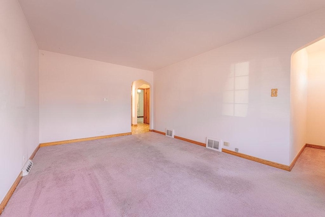 empty room featuring light colored carpet