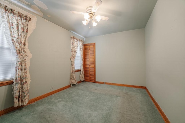 spare room featuring carpet floors and ceiling fan