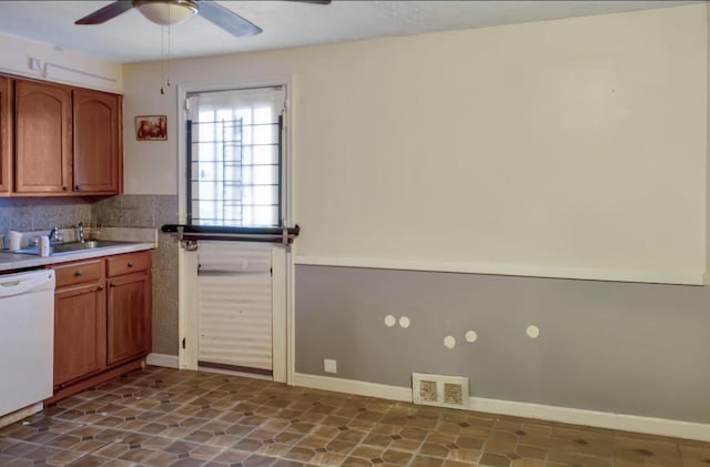 kitchen featuring dishwasher, ceiling fan, decorative backsplash, and sink