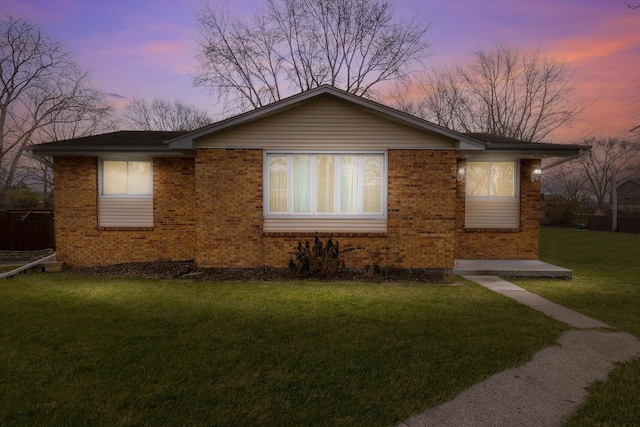 ranch-style house with a yard