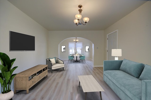 unfurnished room with light wood-type flooring and a chandelier