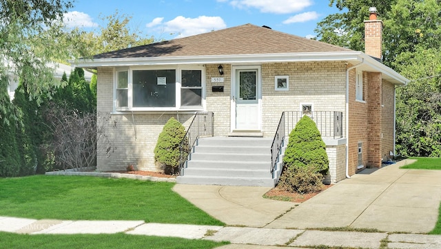 view of front of home with a front lawn