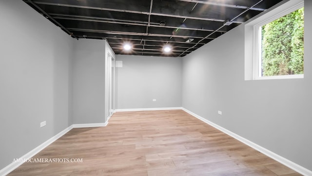 basement featuring light hardwood / wood-style flooring