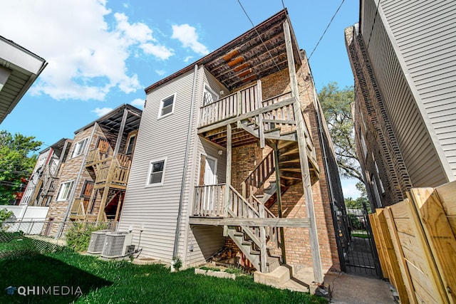 view of side of home featuring central AC unit