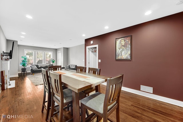 dining area with dark wood-type flooring