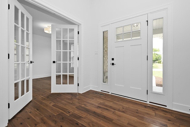 entrance foyer with french doors and dark wood-type flooring