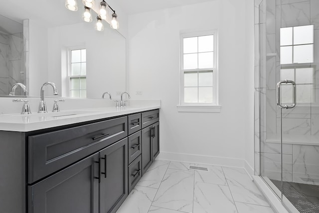 bathroom with vanity and an enclosed shower