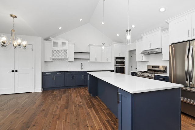 kitchen with pendant lighting, dark hardwood / wood-style floors, a kitchen island, white cabinetry, and stainless steel appliances