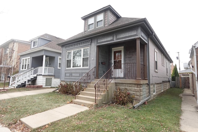 bungalow-style house with a front yard