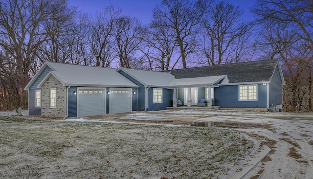 ranch-style house featuring a garage