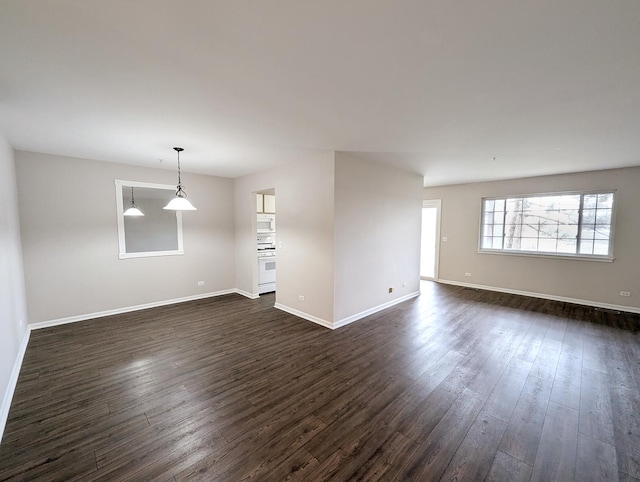 spare room with dark wood-type flooring