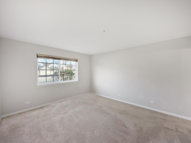 empty room with light colored carpet