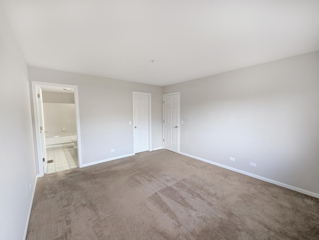 spare room featuring carpet flooring