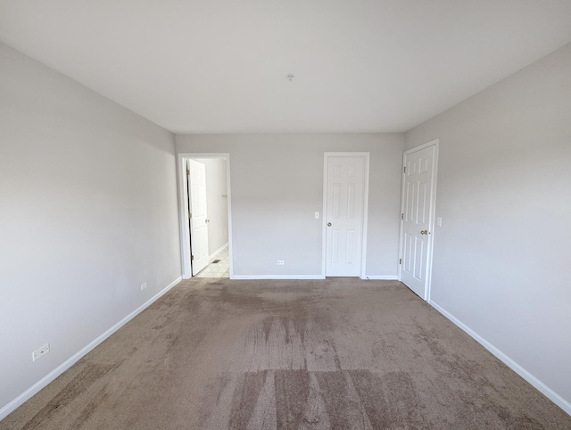 unfurnished room featuring carpet floors