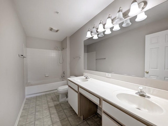 full bathroom featuring tile patterned floors, vanity, toilet, and tiled shower / bath