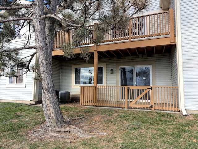 back of house with central AC and a wooden deck