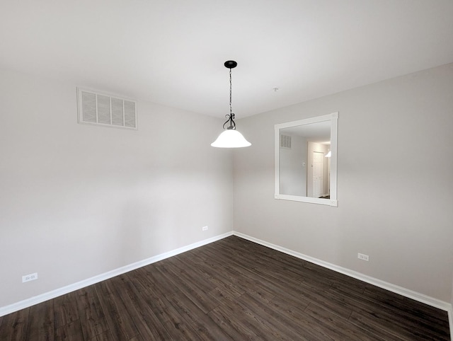 unfurnished room featuring dark hardwood / wood-style flooring