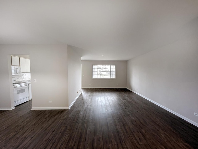 unfurnished room with dark wood-type flooring