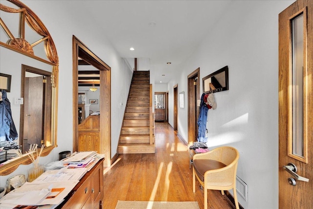 entryway with light hardwood / wood-style floors