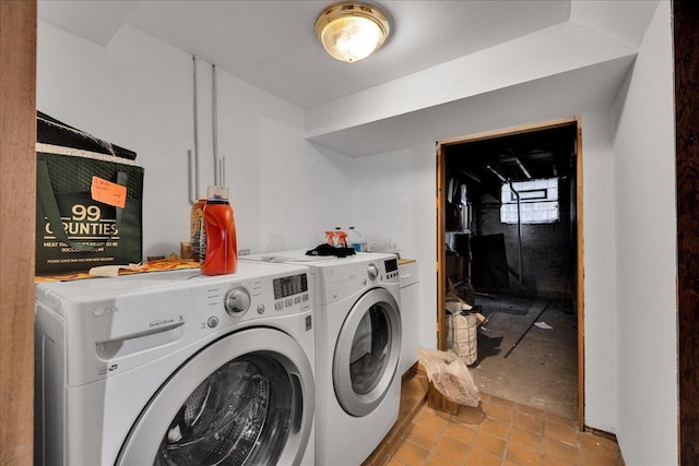 washroom featuring washer and dryer