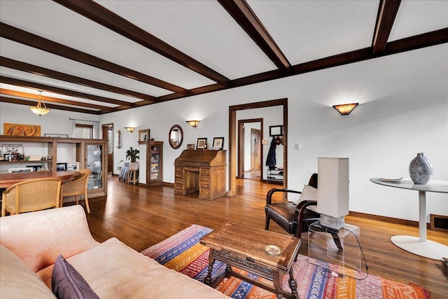 living room featuring wood-type flooring and beam ceiling