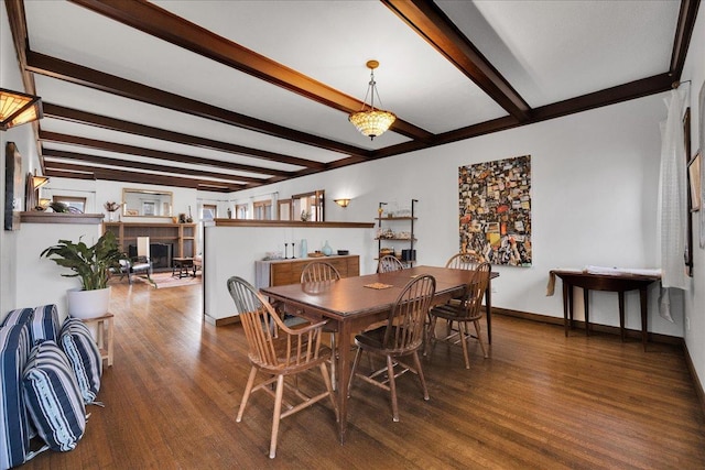 dining room with beamed ceiling, dark hardwood / wood-style floors, and an inviting chandelier