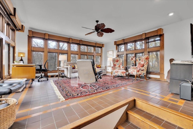 tiled living room with ceiling fan