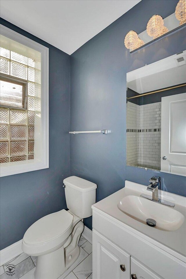 bathroom with vanity and toilet