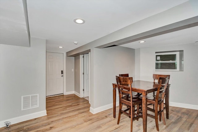 dining room with light wood-type flooring