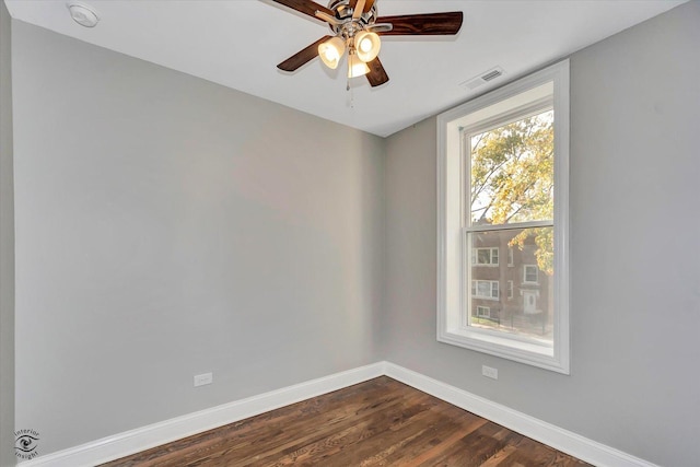 unfurnished room featuring ceiling fan and dark hardwood / wood-style flooring