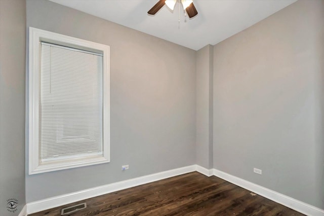 spare room featuring ceiling fan and dark hardwood / wood-style floors