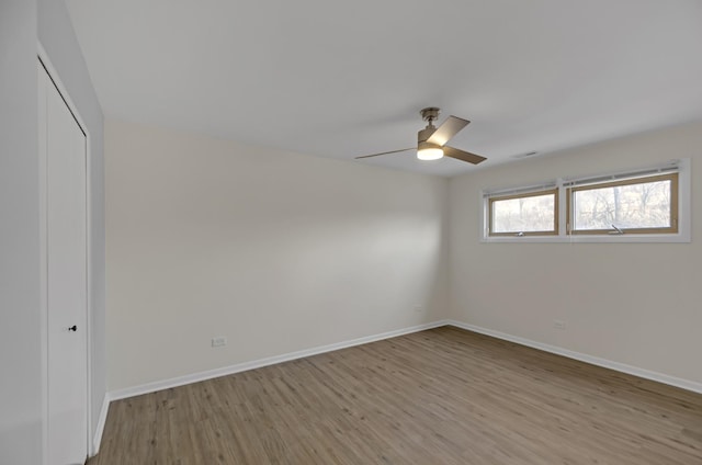 spare room featuring ceiling fan and light hardwood / wood-style floors