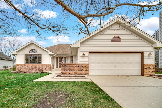 view of front of home with a garage and a front yard