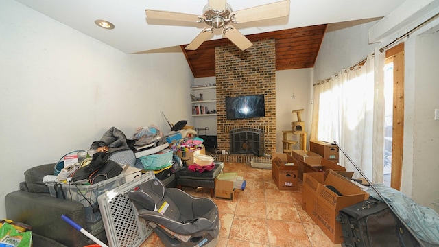 living room featuring a fireplace, ceiling fan, and lofted ceiling