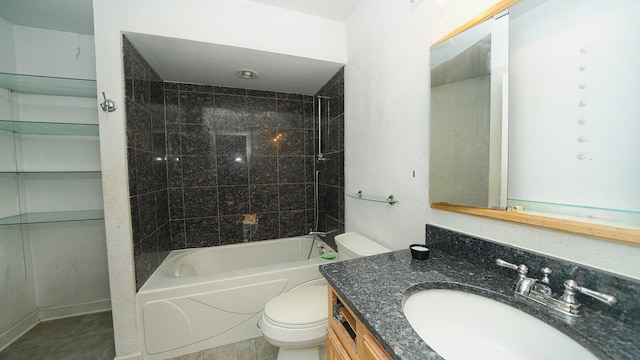 full bathroom with tile patterned floors, vanity, toilet, and tiled shower / bath