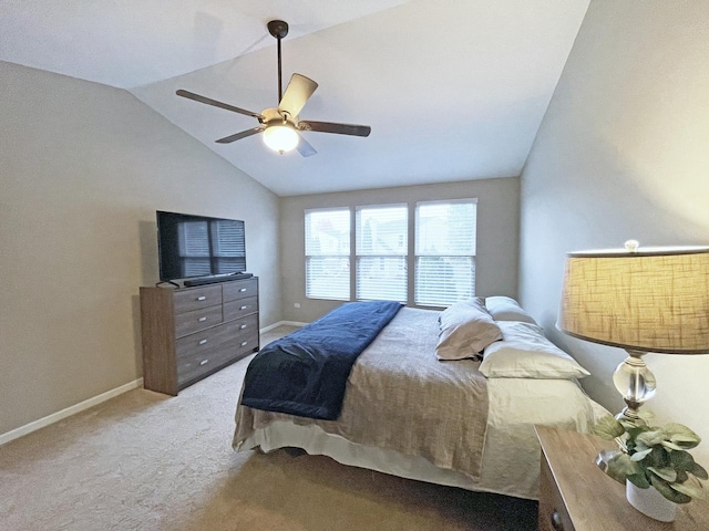 bedroom featuring lofted ceiling, a ceiling fan, baseboards, and carpet floors