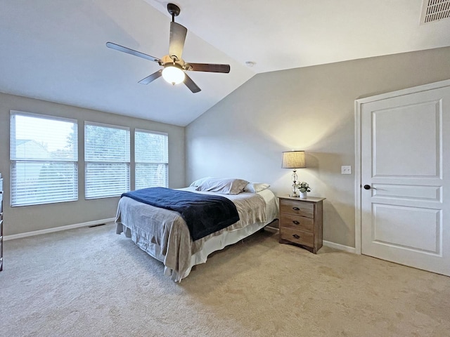 bedroom with visible vents, baseboards, lofted ceiling, ceiling fan, and light colored carpet