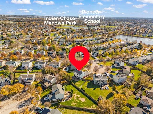 bird's eye view featuring a residential view and a water view