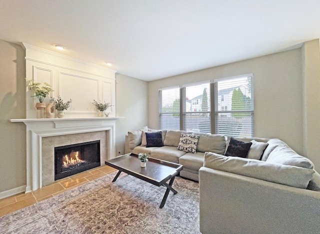 living area with a tiled fireplace