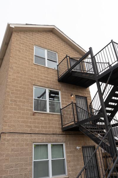 view of side of home featuring a balcony