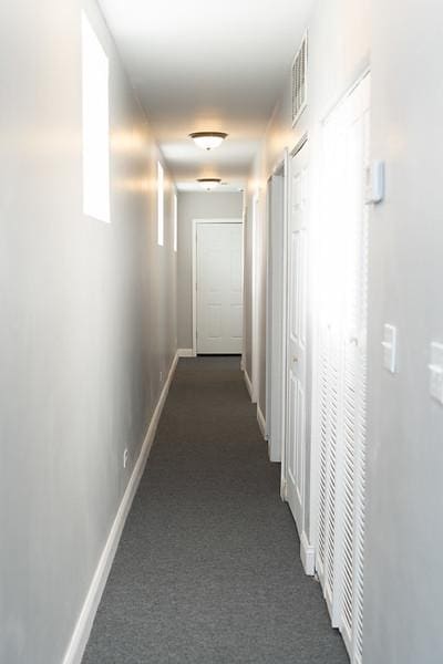 corridor with dark carpet