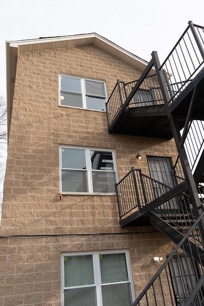 view of side of property with a balcony