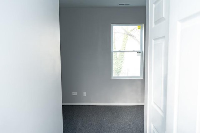 unfurnished room with carpet flooring