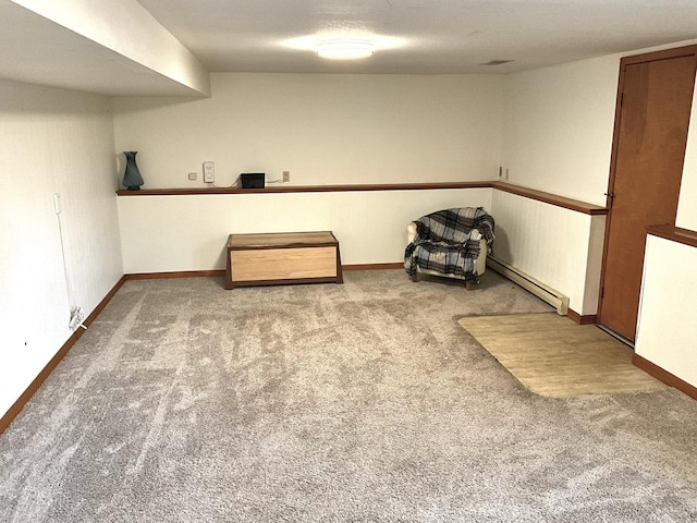 basement with carpet and baseboard heating