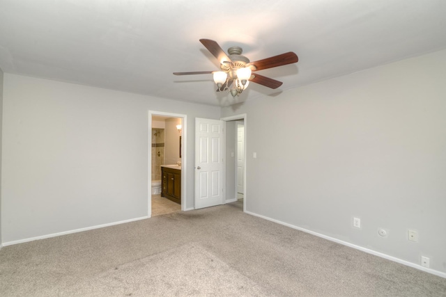 carpeted empty room featuring ceiling fan