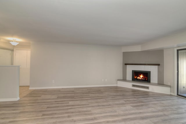 unfurnished living room featuring light hardwood / wood-style floors