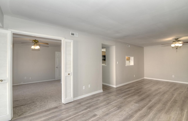 unfurnished room featuring ceiling fan and light hardwood / wood-style flooring