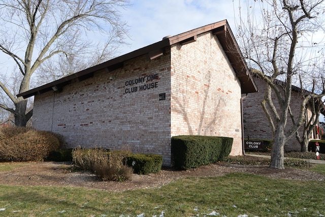 view of property exterior with a yard