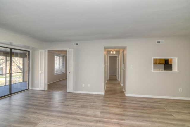 unfurnished room featuring light hardwood / wood-style floors