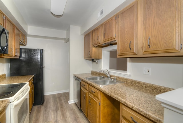 kitchen with white range with electric stovetop, light hardwood / wood-style flooring, stainless steel dishwasher, and sink